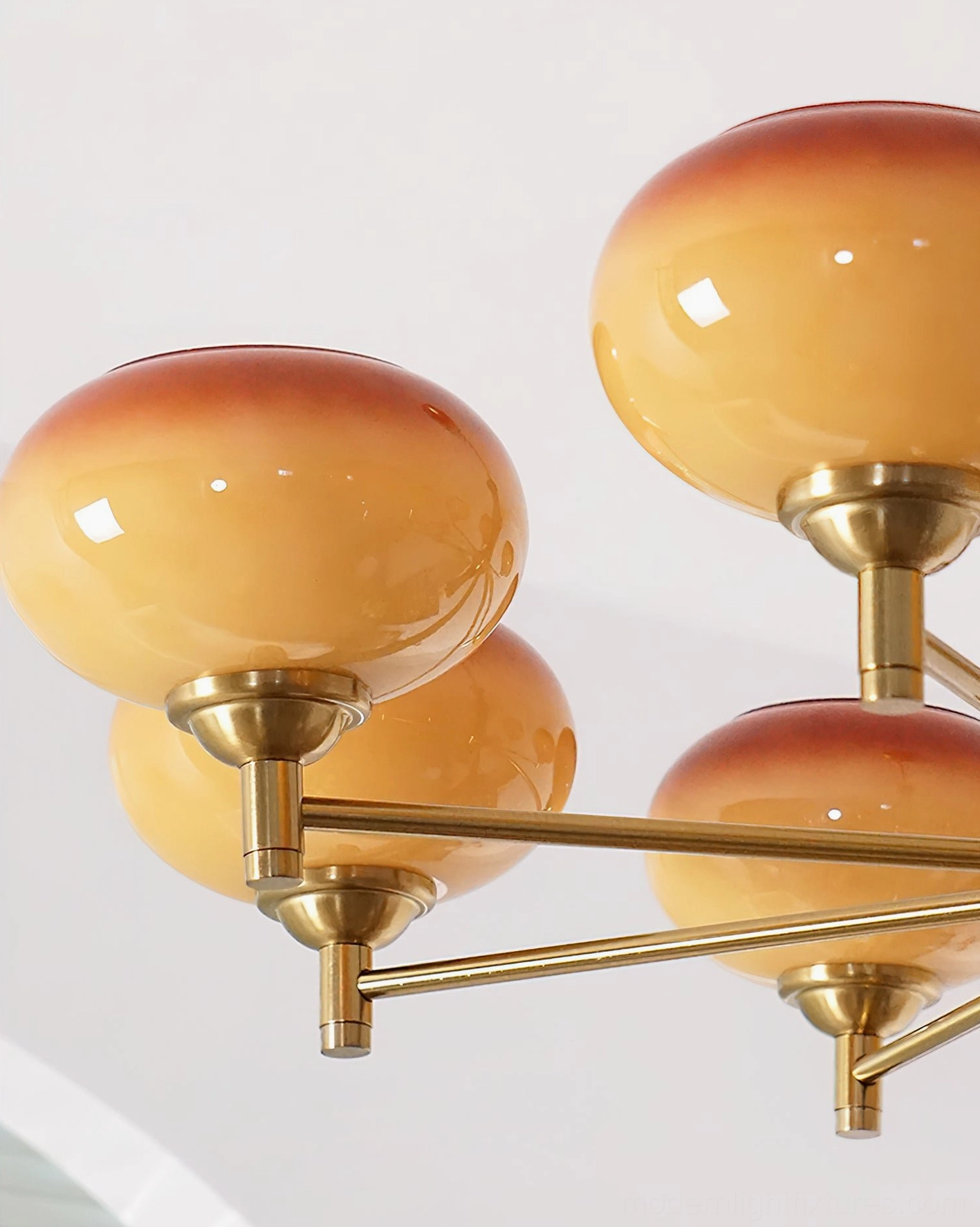 3-head vintage chandelier with caramel color glass shades, copper brass arms, and dark wood stem in mid-century modern style