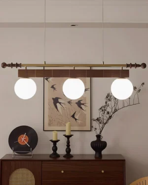 3-head Curvira chandelier with walnut wood beam in vintage dining room interior, mid-century modern styling