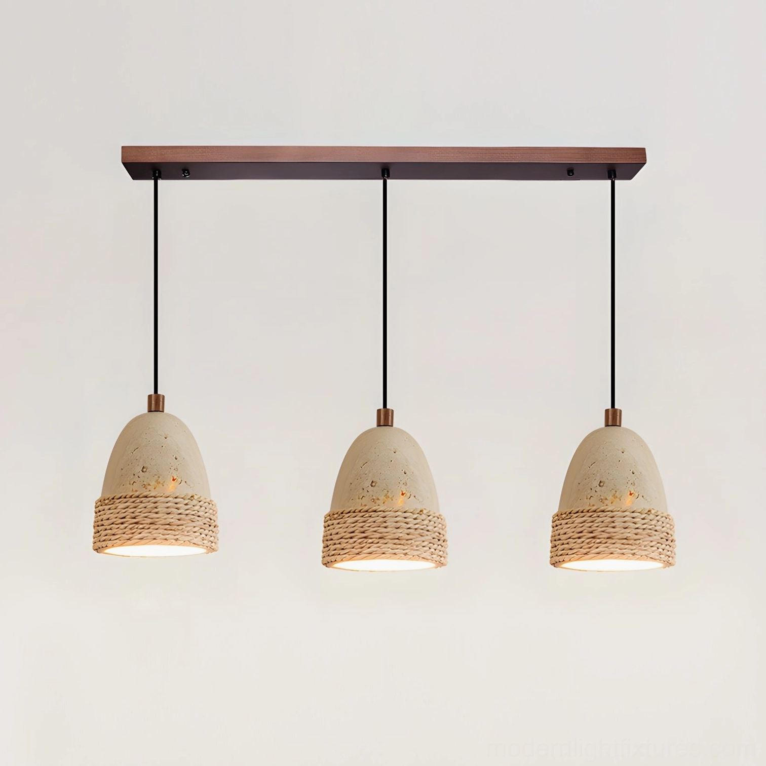 3-head Baskra pendant light configuration installed above kitchen table in warm neutral tones