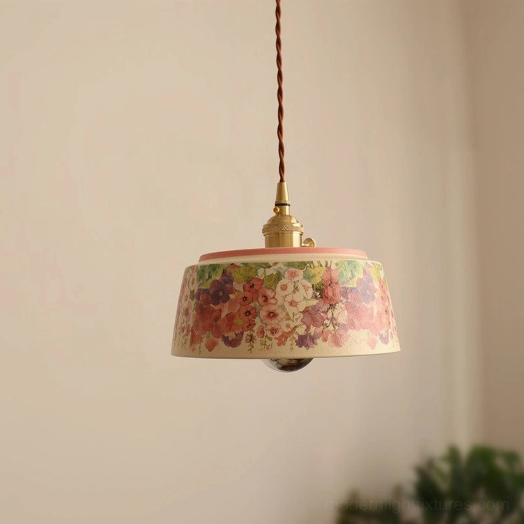 3-light linear pendant installation above dining table with watercolor ceramic shades