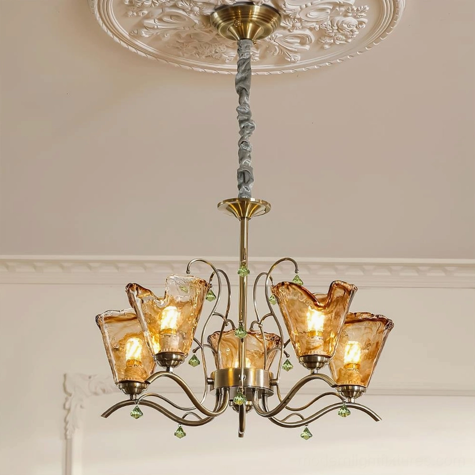 5-head Vetraio amber glass chandelier with bronze arms, installed ceiling view in vintage living room showing warm illumination and artistic glass work