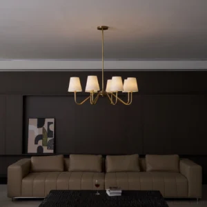 5-light modern brass chandelier in luxury living room, warm off-white fabric shades, contemporary interior design