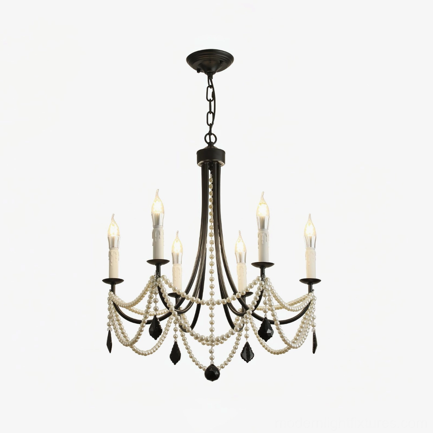 6-head black and white pearl crystal chandelier in dining room setting creating dramatic ambient lighting