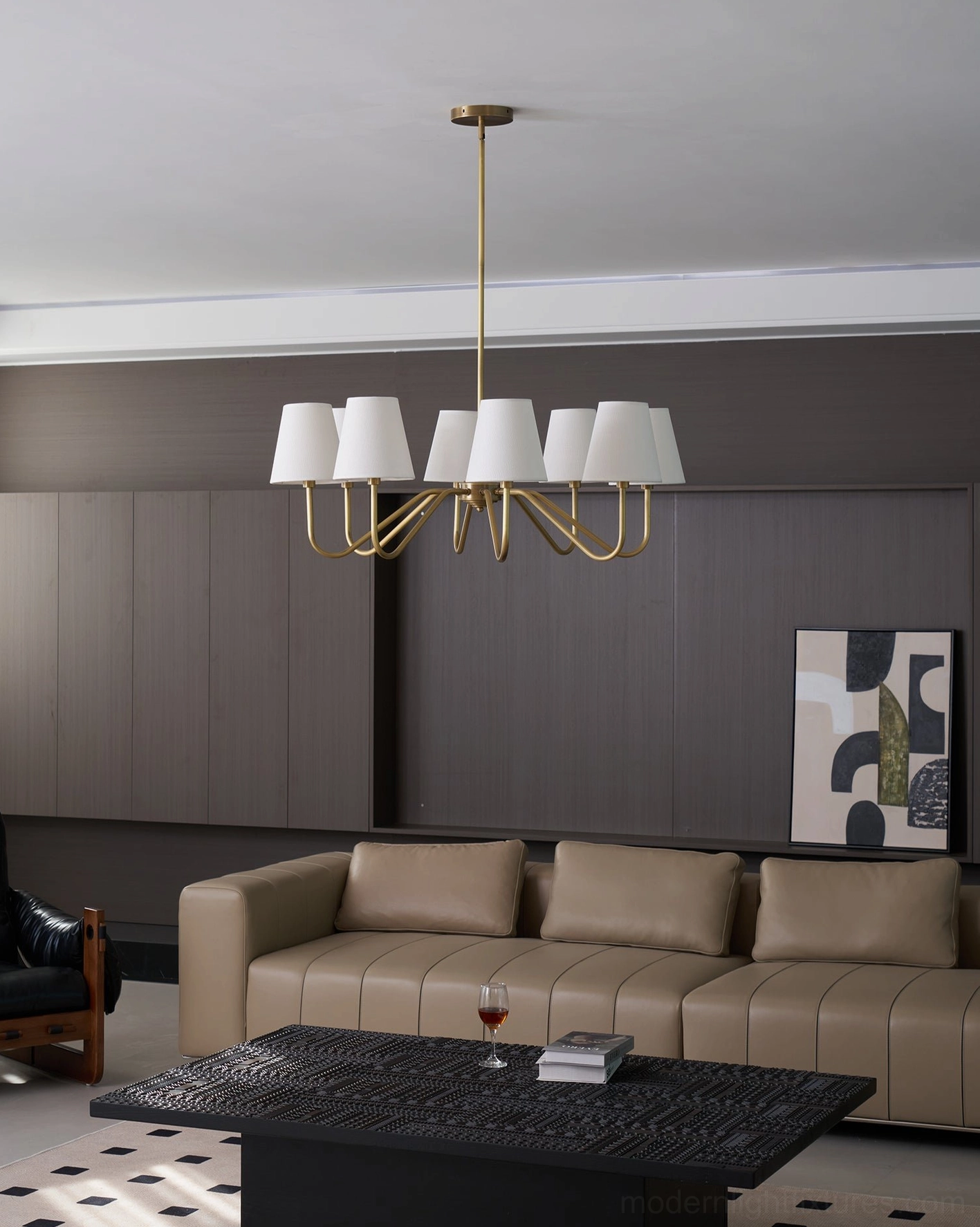 6-light brass chandelier in neutral modern living room, brushed brass arms, minimalist luxury style, eye-level view