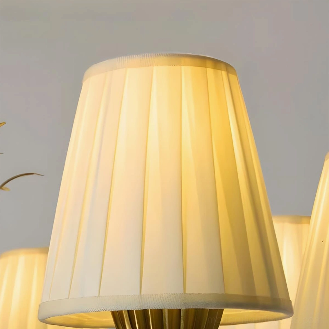 Mid-century modern 6-light chandelier with brass frame and pleated fabric shades, product photography