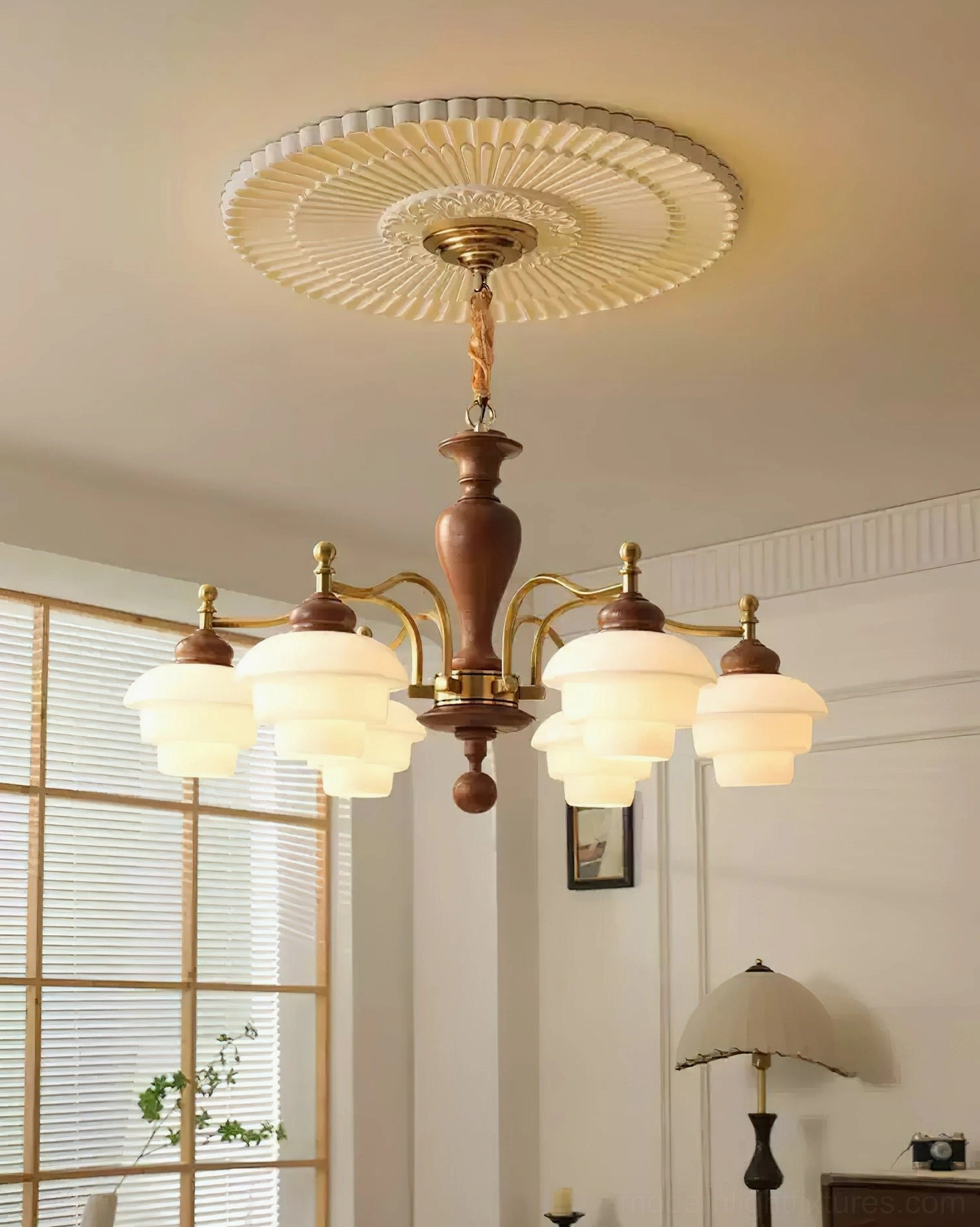 6-light traditional chandelier overhead view in minimalist living room with louvered windows - walnut wood with brass hardware and pleated ceiling medallion
