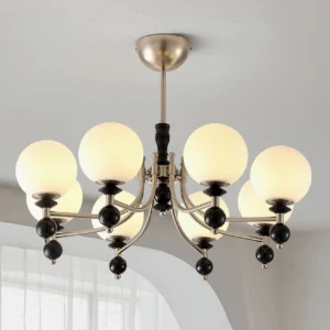 8-head black metal globe chandelier in bright home interior with arched window - vintage mid-century pendant lighting
