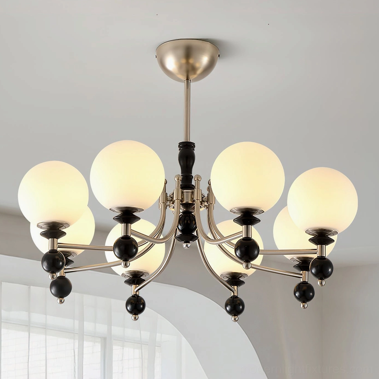 8-head black metal globe chandelier in bright home interior with arched window - vintage mid-century pendant lighting