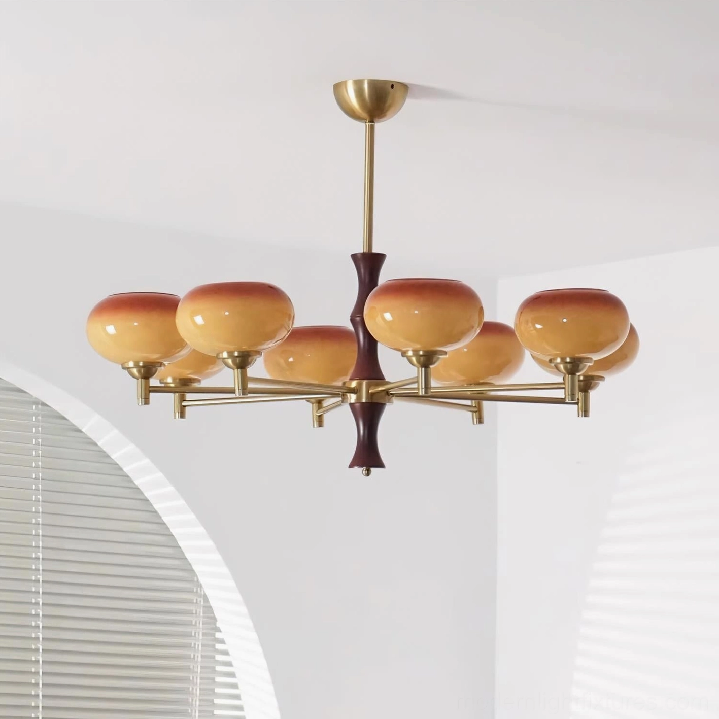 8-head chandelier with caramel color glass shades and copper brass finish, dark wood column, mid-century modern design aesthetic