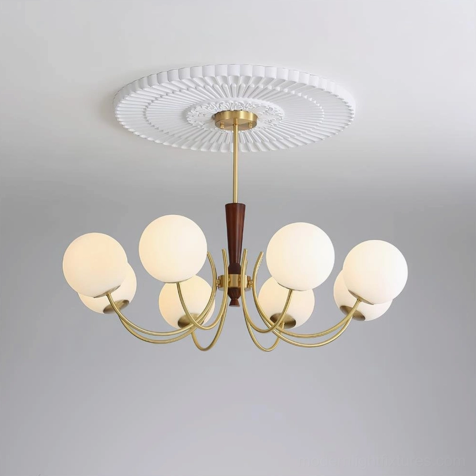 Studio photograph of 8-head globe chandelier with brass metal arms, walnut wood fixture, and frosted glass globes