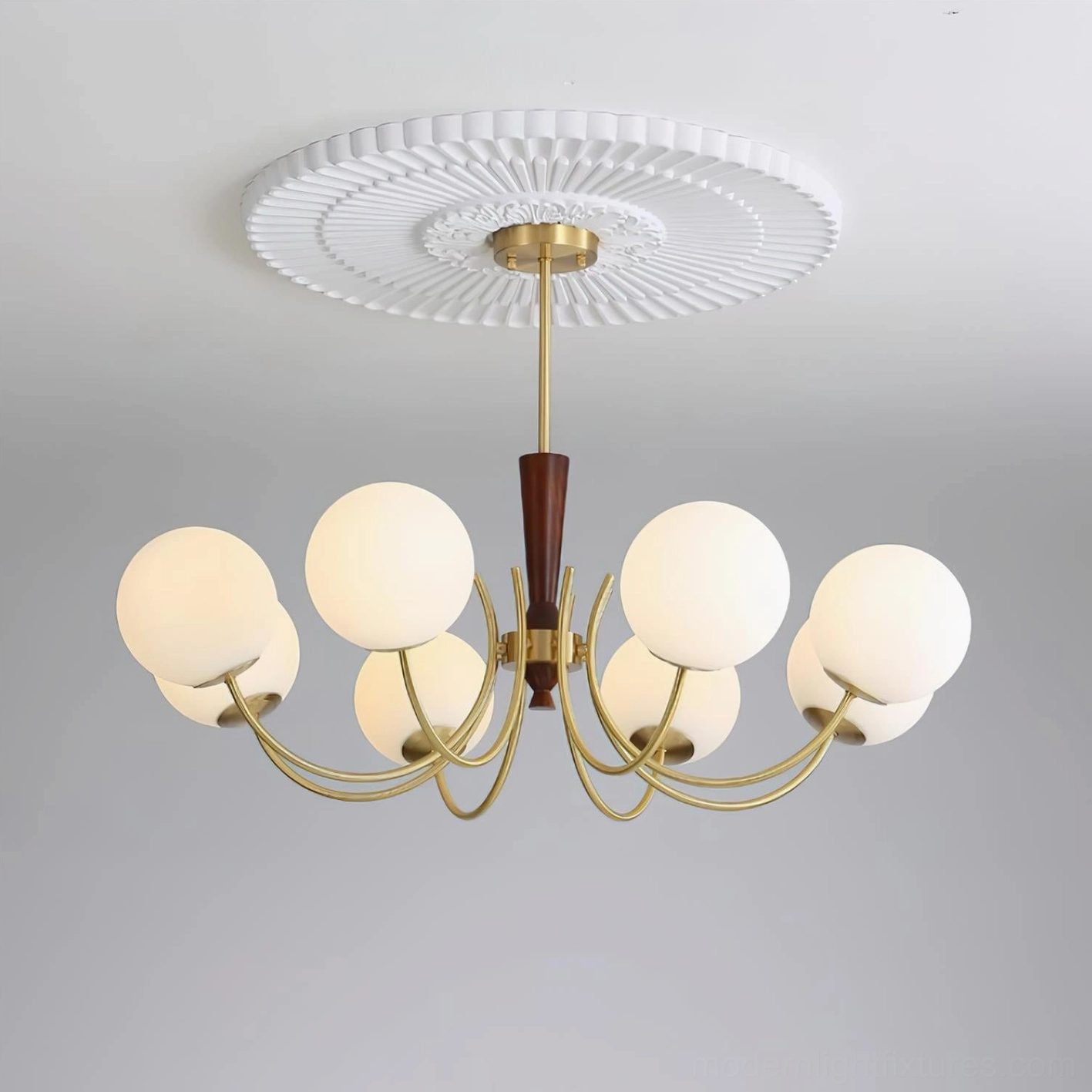 Fully illuminated 8-head globe chandelier showcasing brass frame, walnut wood trim, and included ceiling medallion