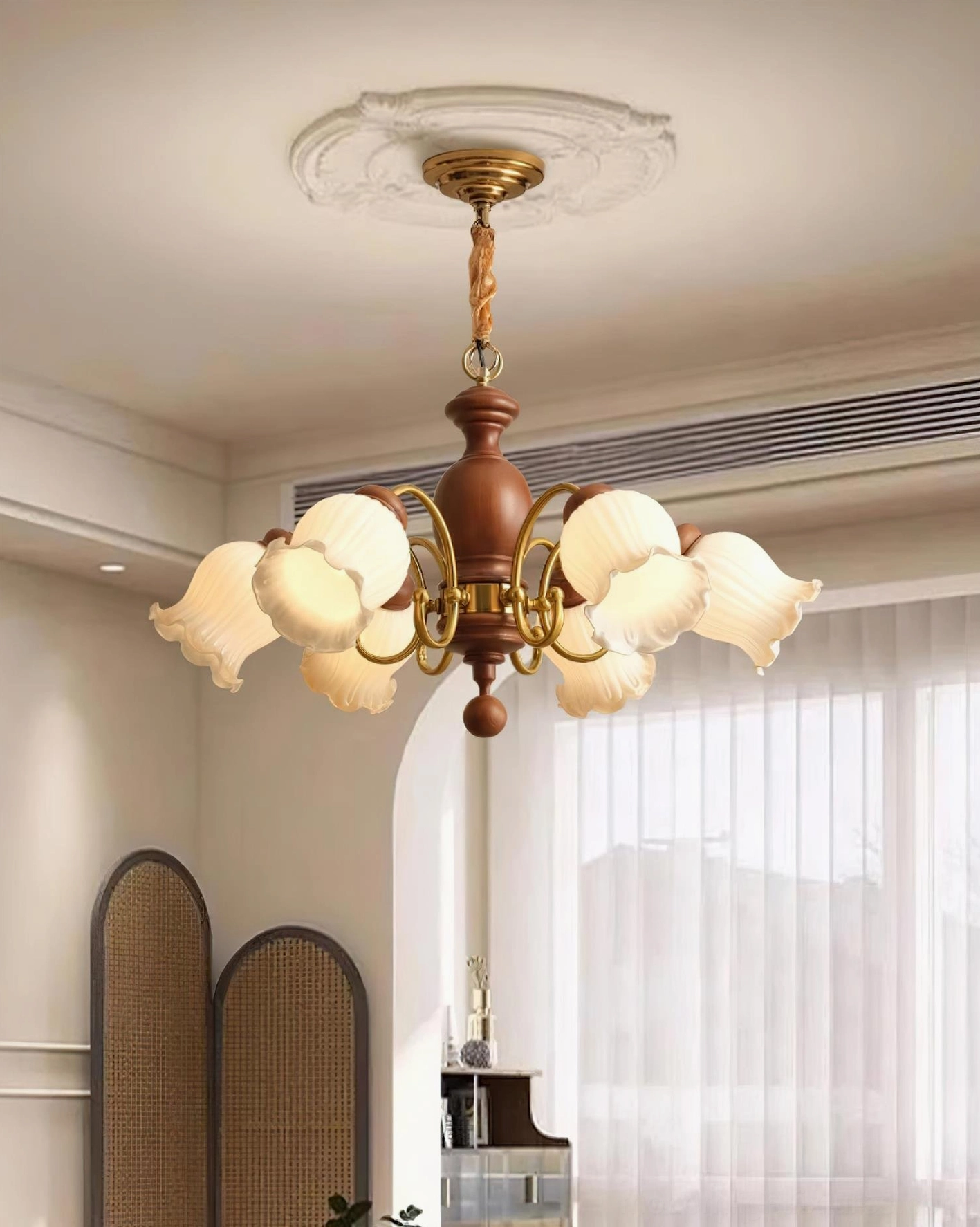 8-head vintage lily chandelier installed in colonial-style room with window blinds and decorative screen