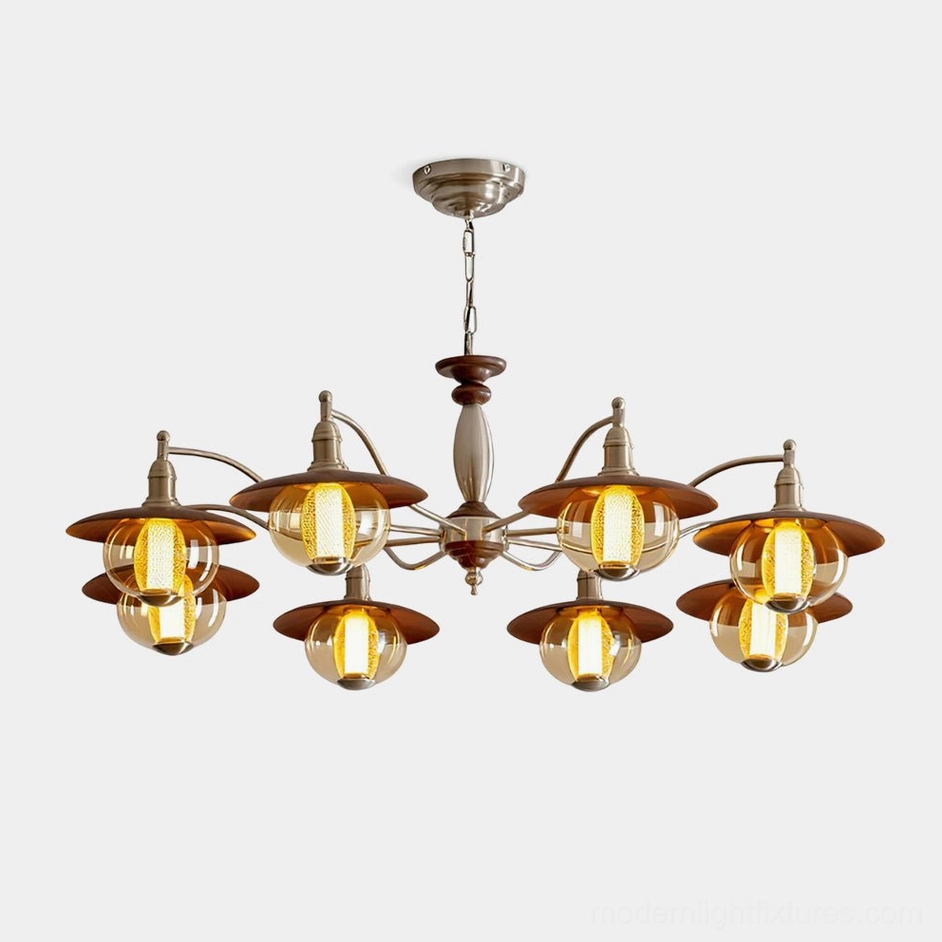8-light coachlight globe chandelier with brushed nickel frame, wood accents, and amber tinted glass shades - front studio view