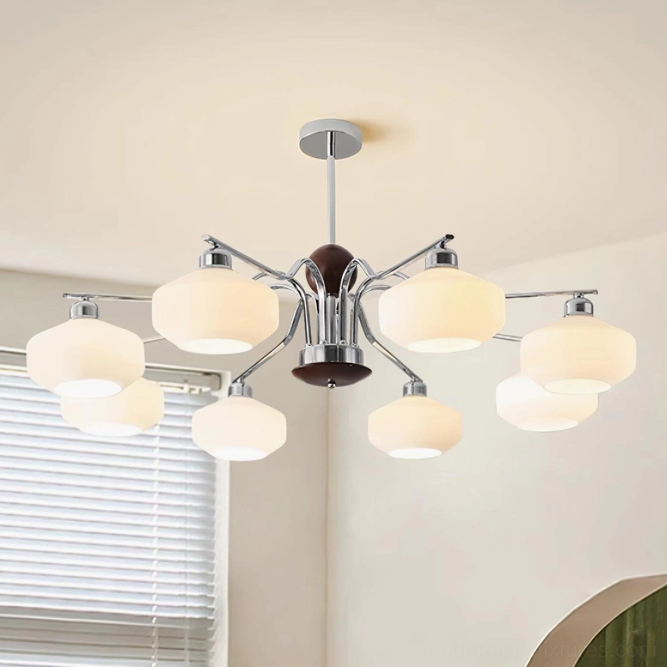 8-light mid-century sputnik chandelier in bright room with polished chrome and dark wood details