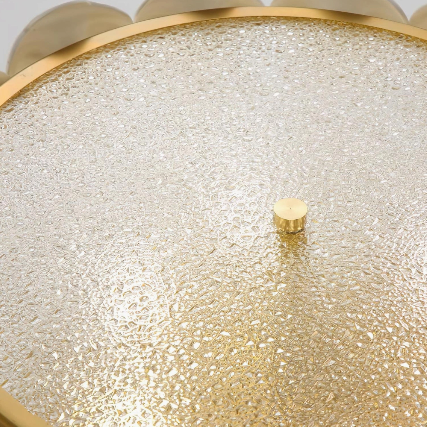Close-up of Abella ceiling light frosted glass diffuser base with textured surface and gold frame edge detail