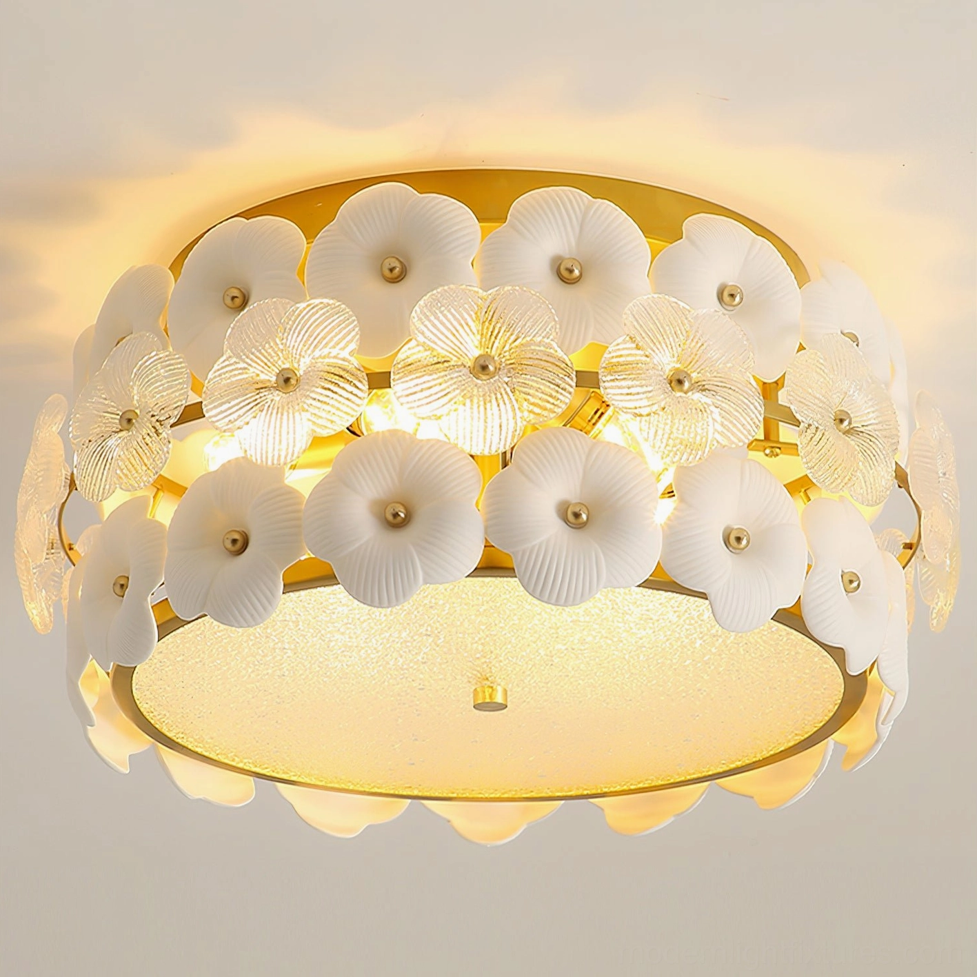 Bright warm interior lighting view of Abella flowers ceiling light showing dense flower decor and glossy gold finish
