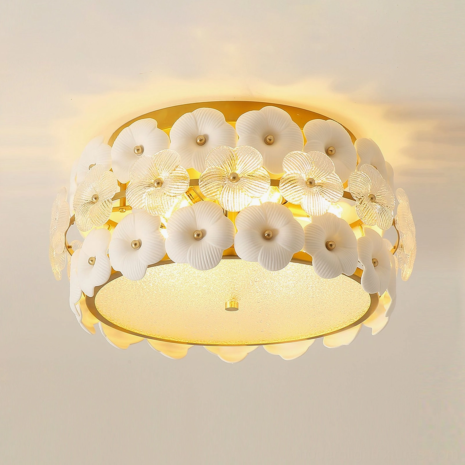 Abella ceramic flowers ceiling fixture with warm ambient lighting, showing flower-trimmed gold frame and soft light diffusion