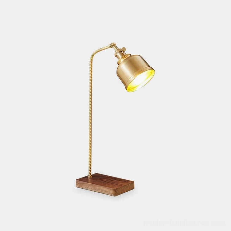 Adjustable brass industrial table lamp with twisted metal stem and walnut wood base, front three-quarter view on white background
