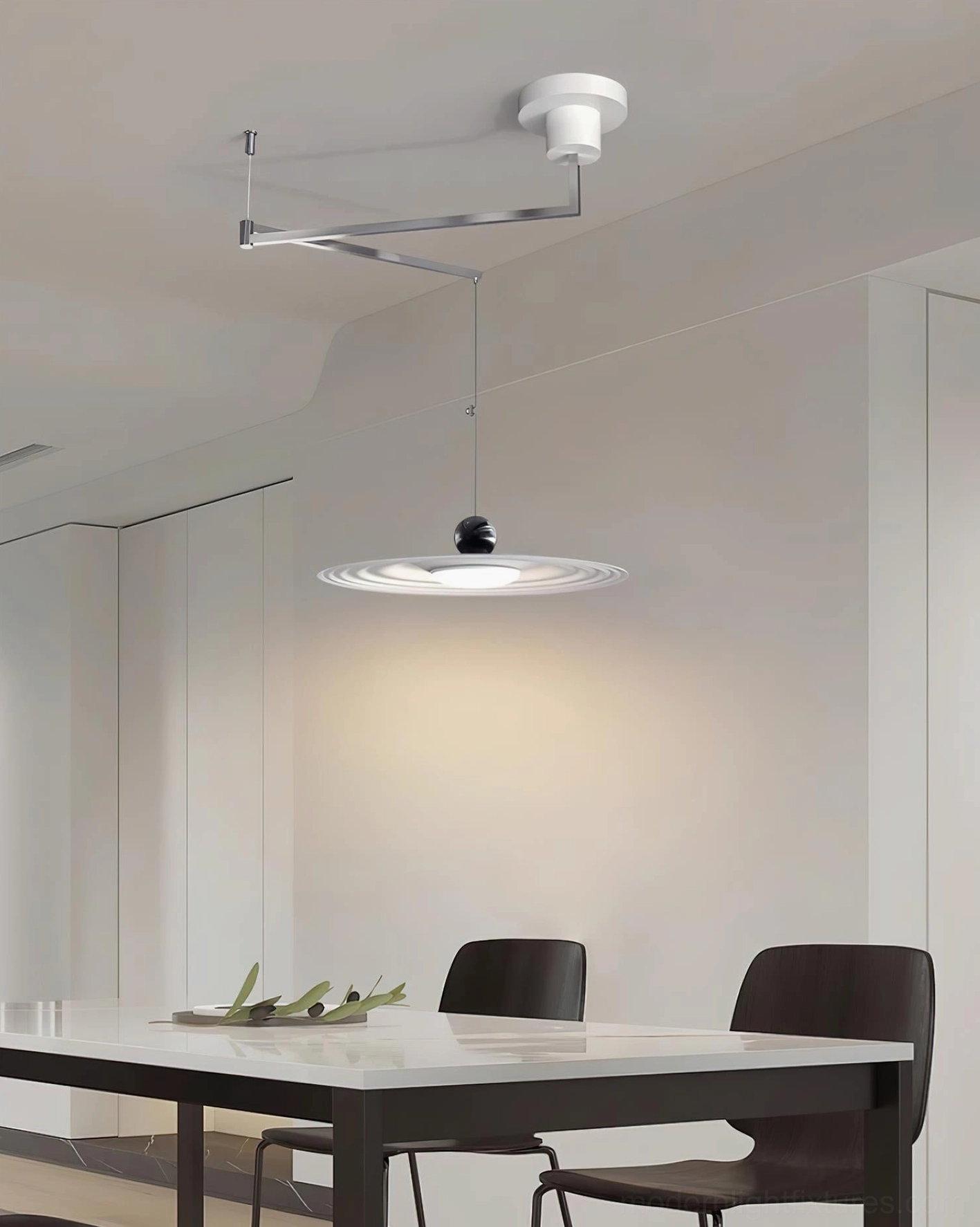 Contemporary adjustable pendant light installation view showing cord and rocker mechanism functionality