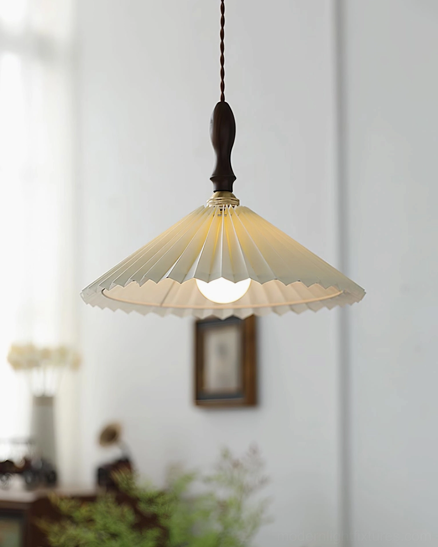 Pleated pendant lamp with adjustable cord length installed at various heights in modern home