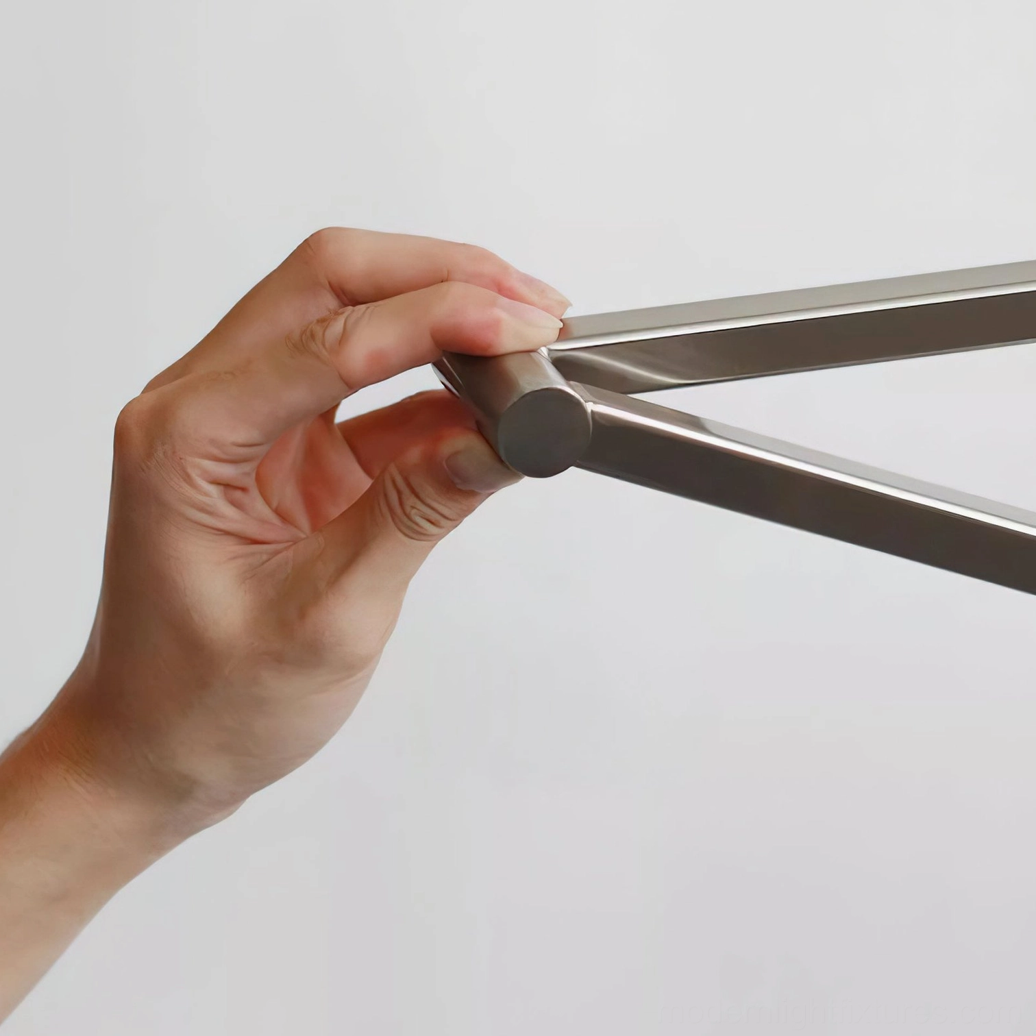 Detailed view of adjustable swing arm mechanism and two-section articulation design