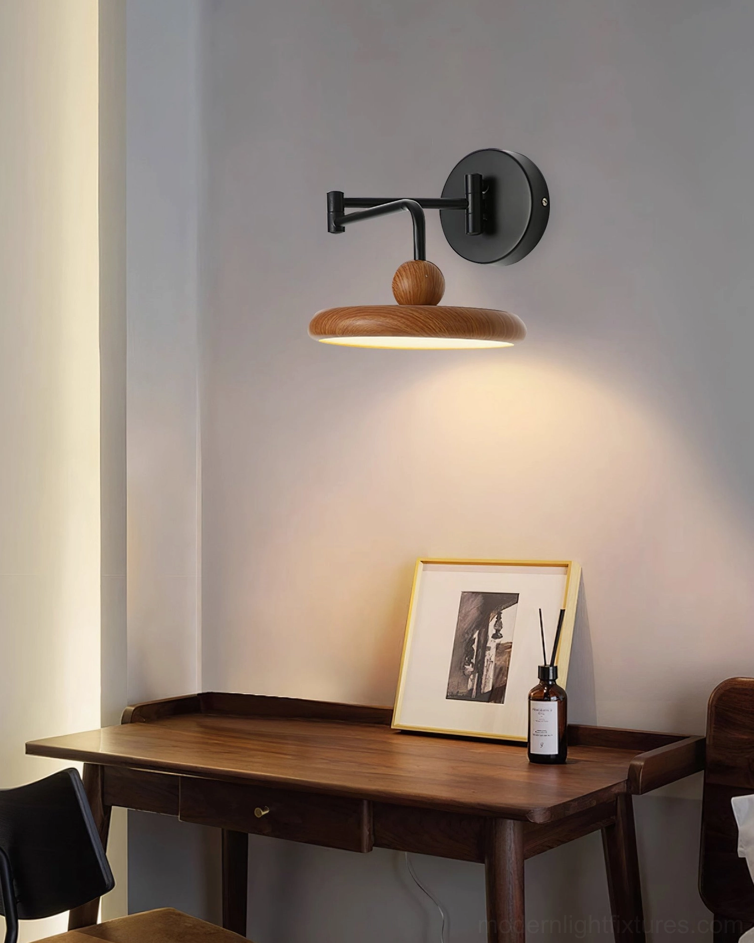 Contemporary adjustable wall sconce with full swing arm extension capability and integrated LED warm white lighting