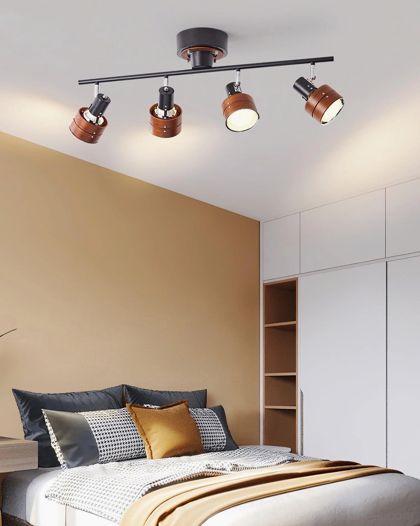 Adjustable track spotlight system with dark walnut wood and black metal in master bedroom with wardrobe