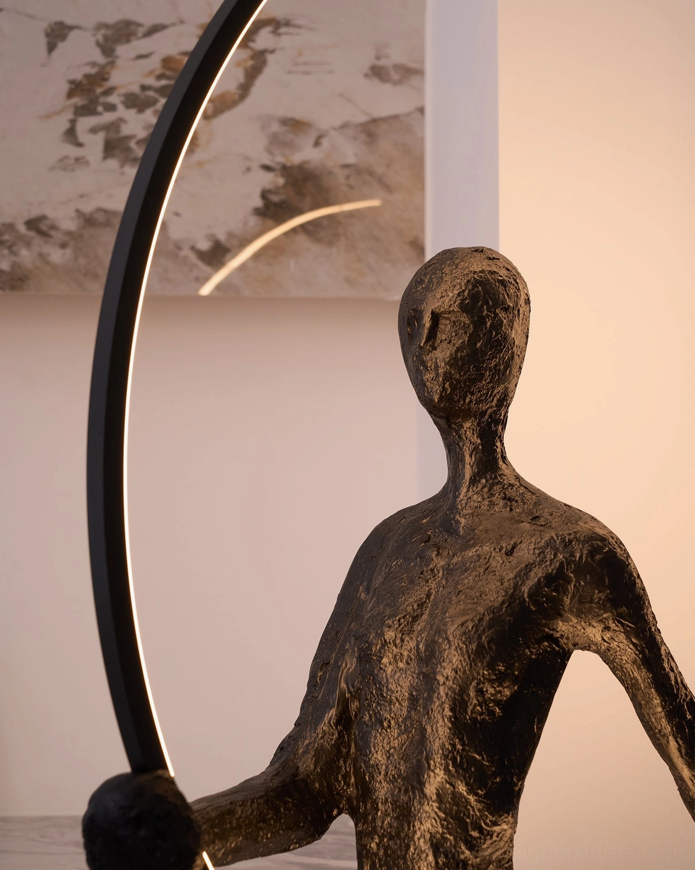 Contemporary minimalist sculpture floor lamp with circular geometric frame and human figure, artistic home decor element