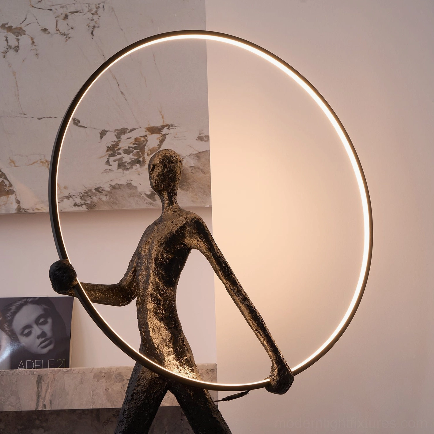 Geometric sculptural floor lamp with integrated LED warm white light, modern interior design accent piece detail view