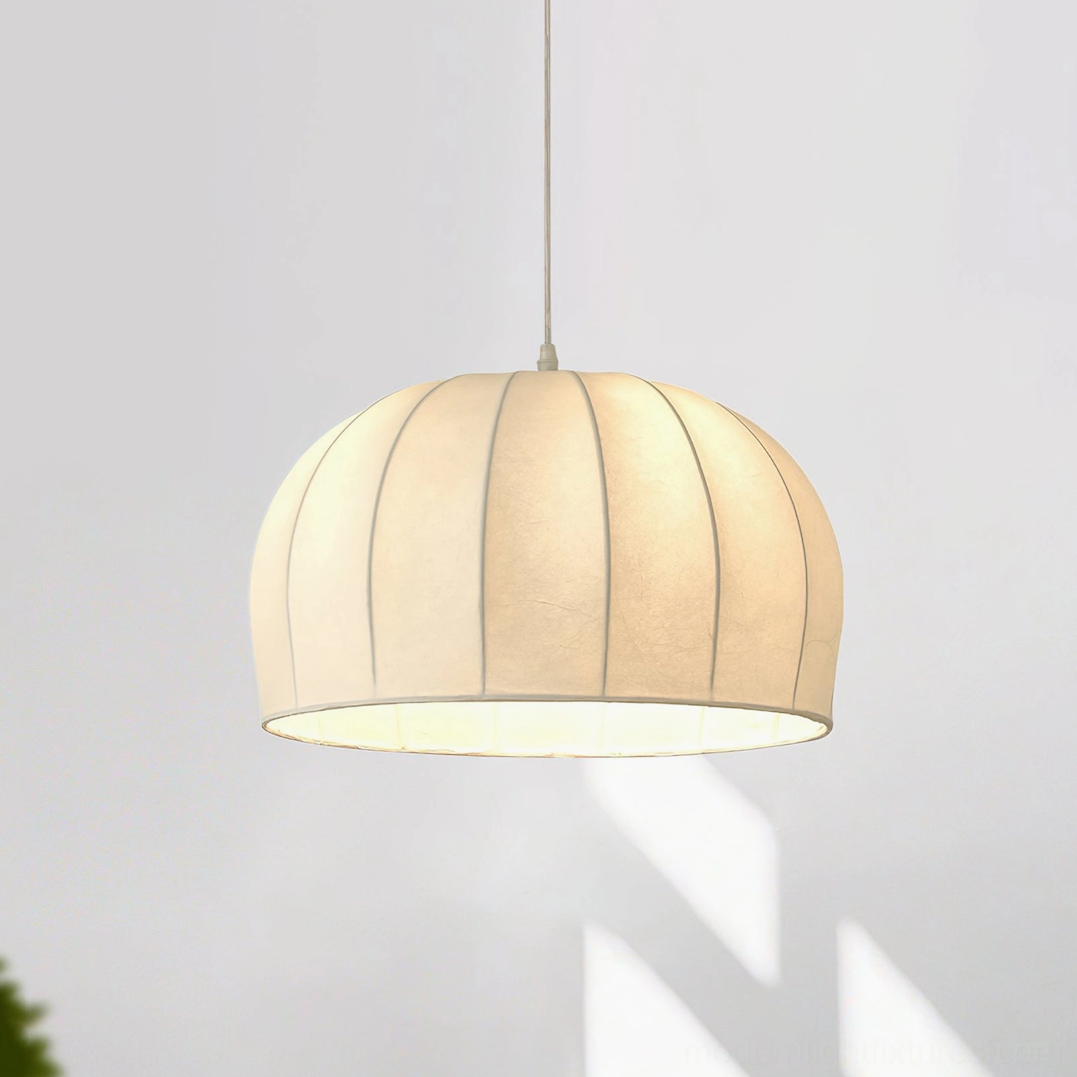 Aeron pendant light with thick ribbed off-white fabric dome shade, natural light shadow detail