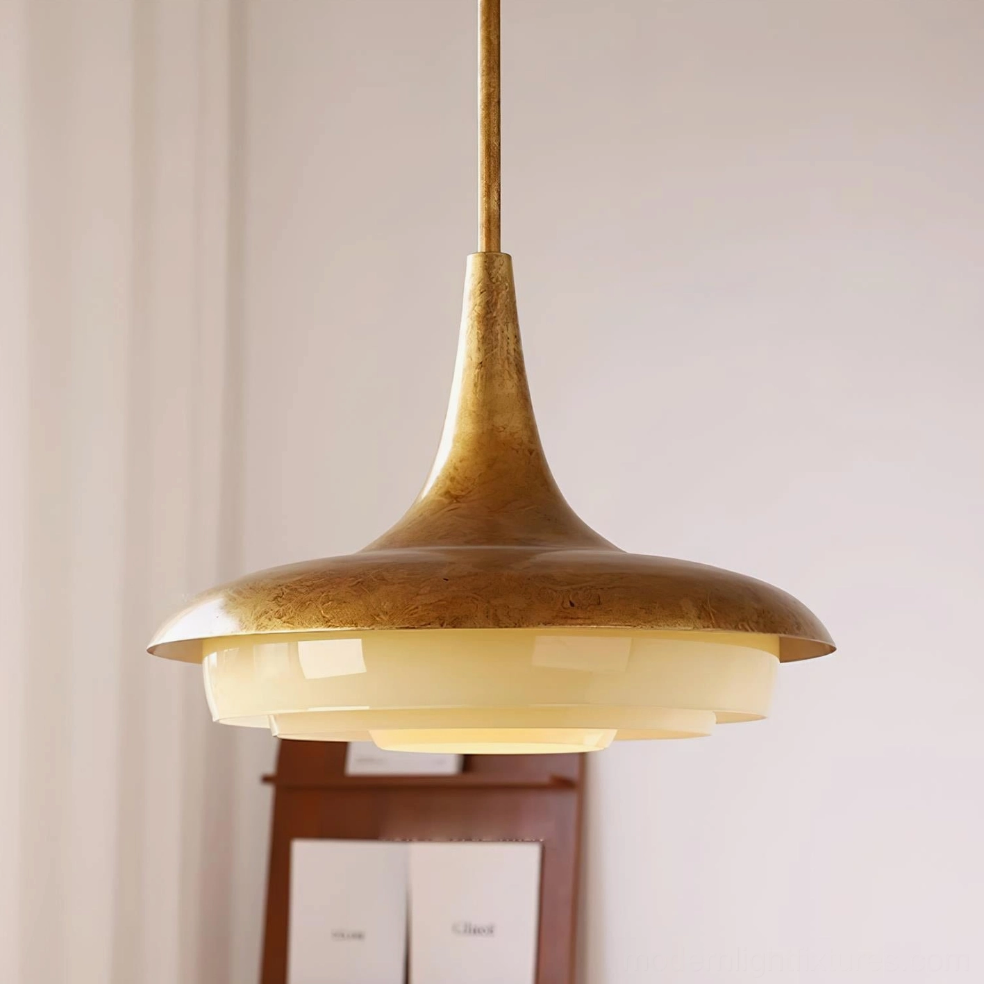 Aged brass pendant lamp with tiered frosted glass dome, side profile close-up of retro warm aesthetic