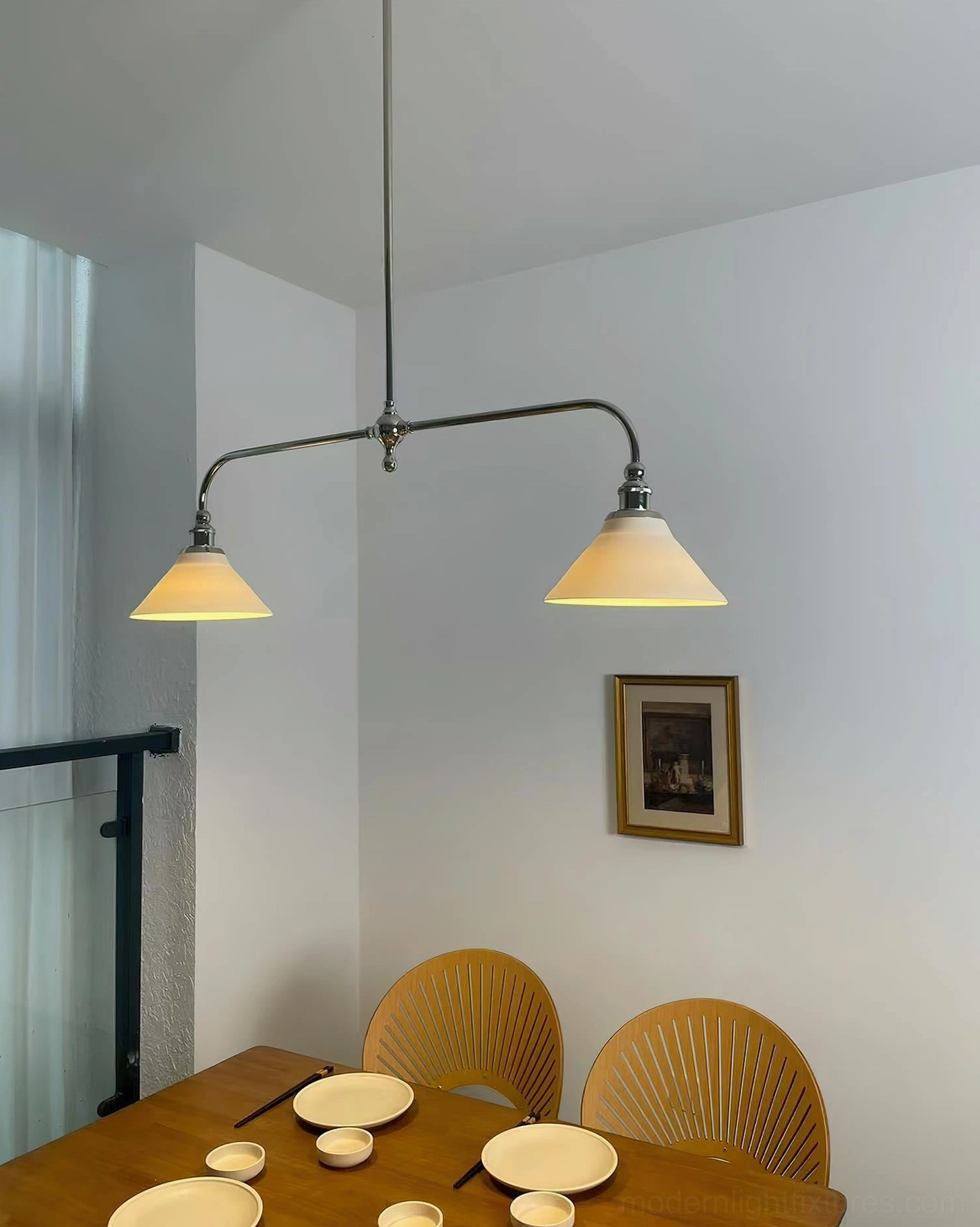 Aged brass two-light linear pendant chandelier showcasing timeless craftsmanship and contemporary minimalist aesthetic