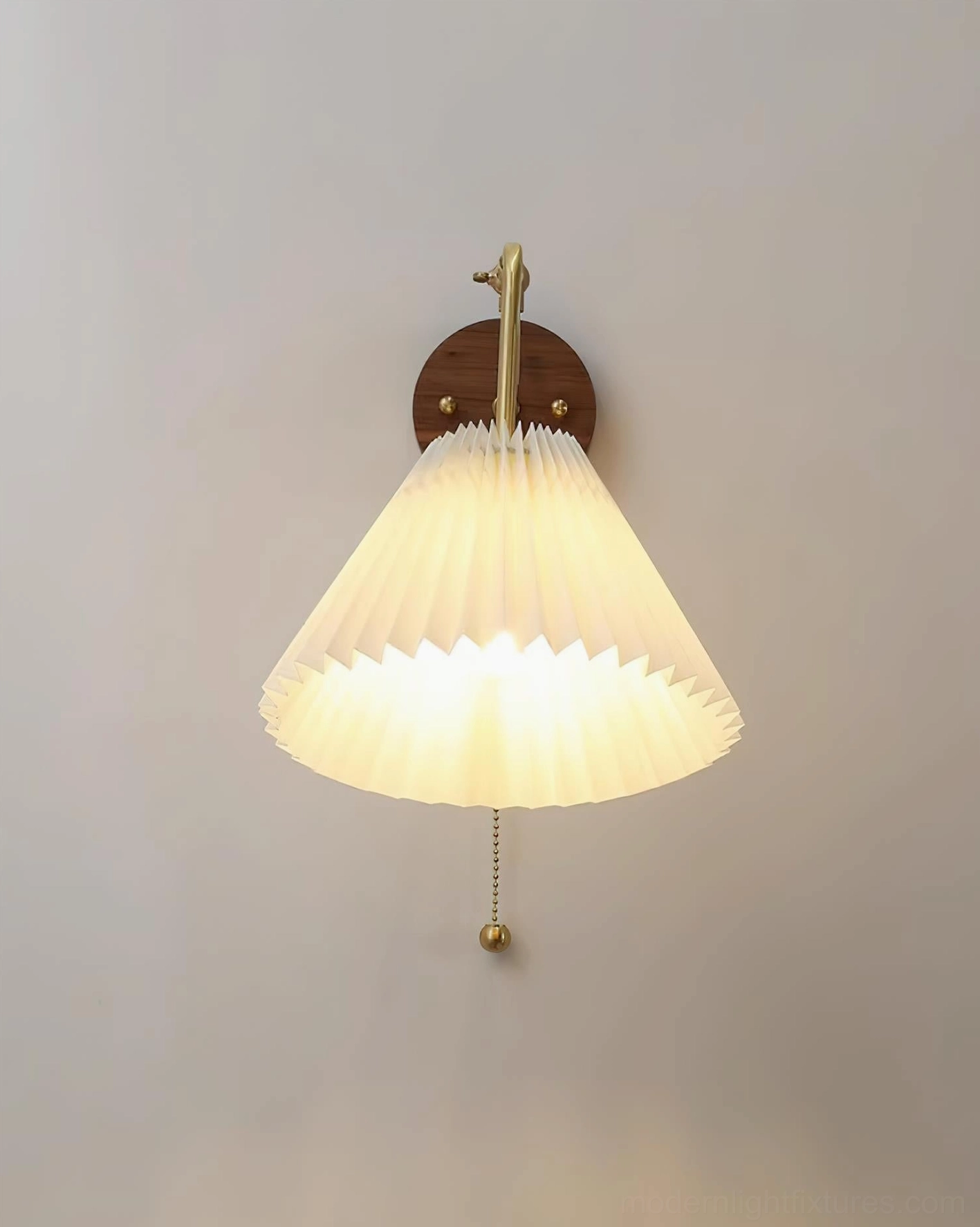 Aine pleated wall sconce brass and white color variant, walnut wood base mounted on residential wall
