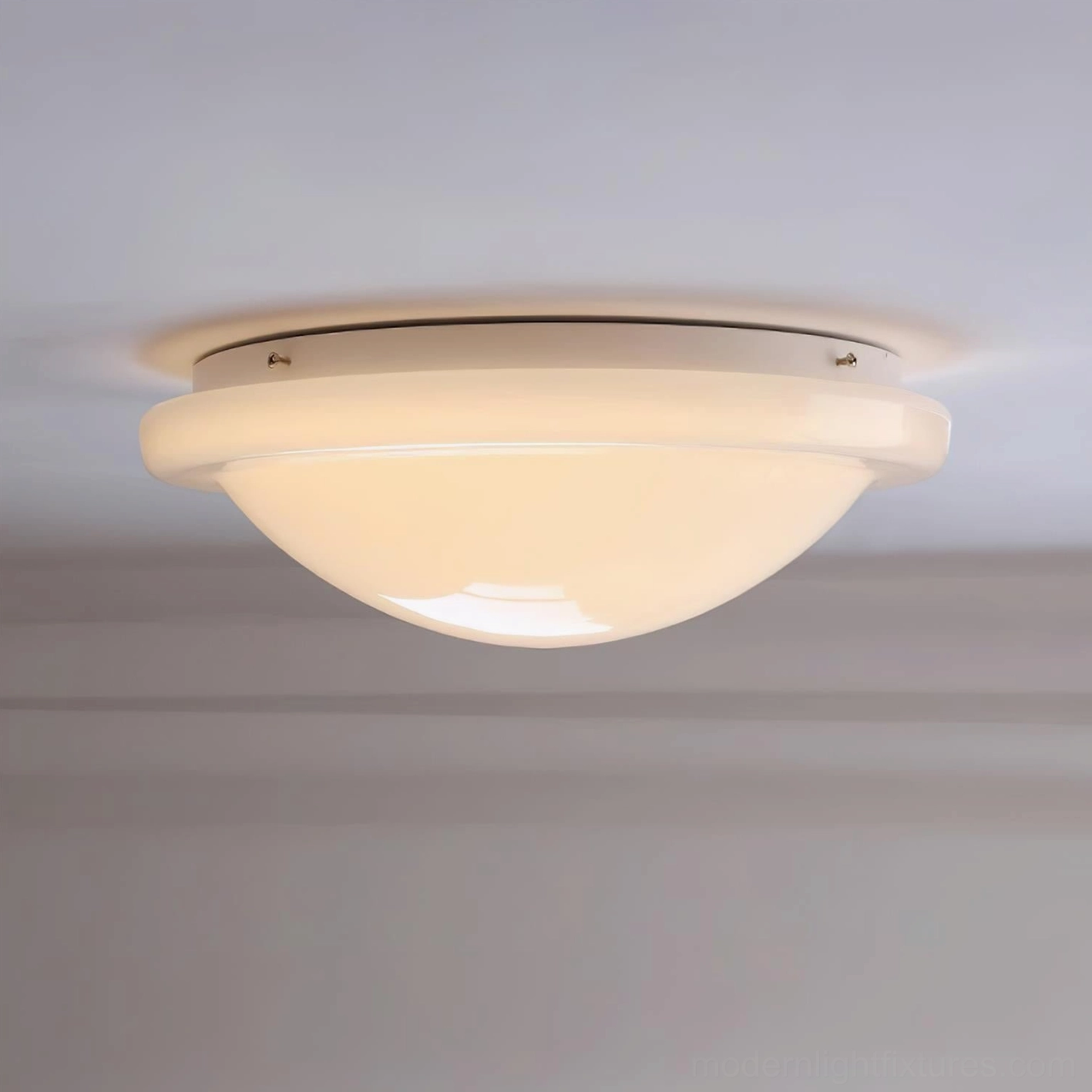 Aire wide flush mount ceiling light fixture installed in room with ceiling trim, visible mounting details and warm ambient illumination