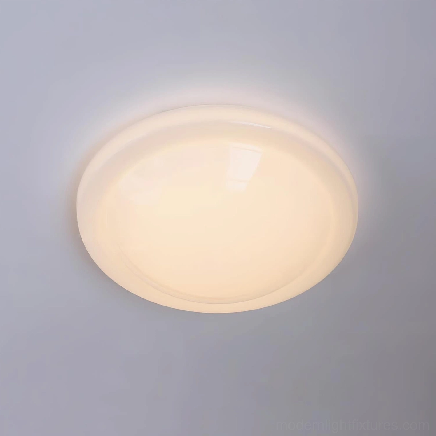 Aire full-dome white ceiling light front top-down view with warm-toned opaque finish and smooth reflective surface finish