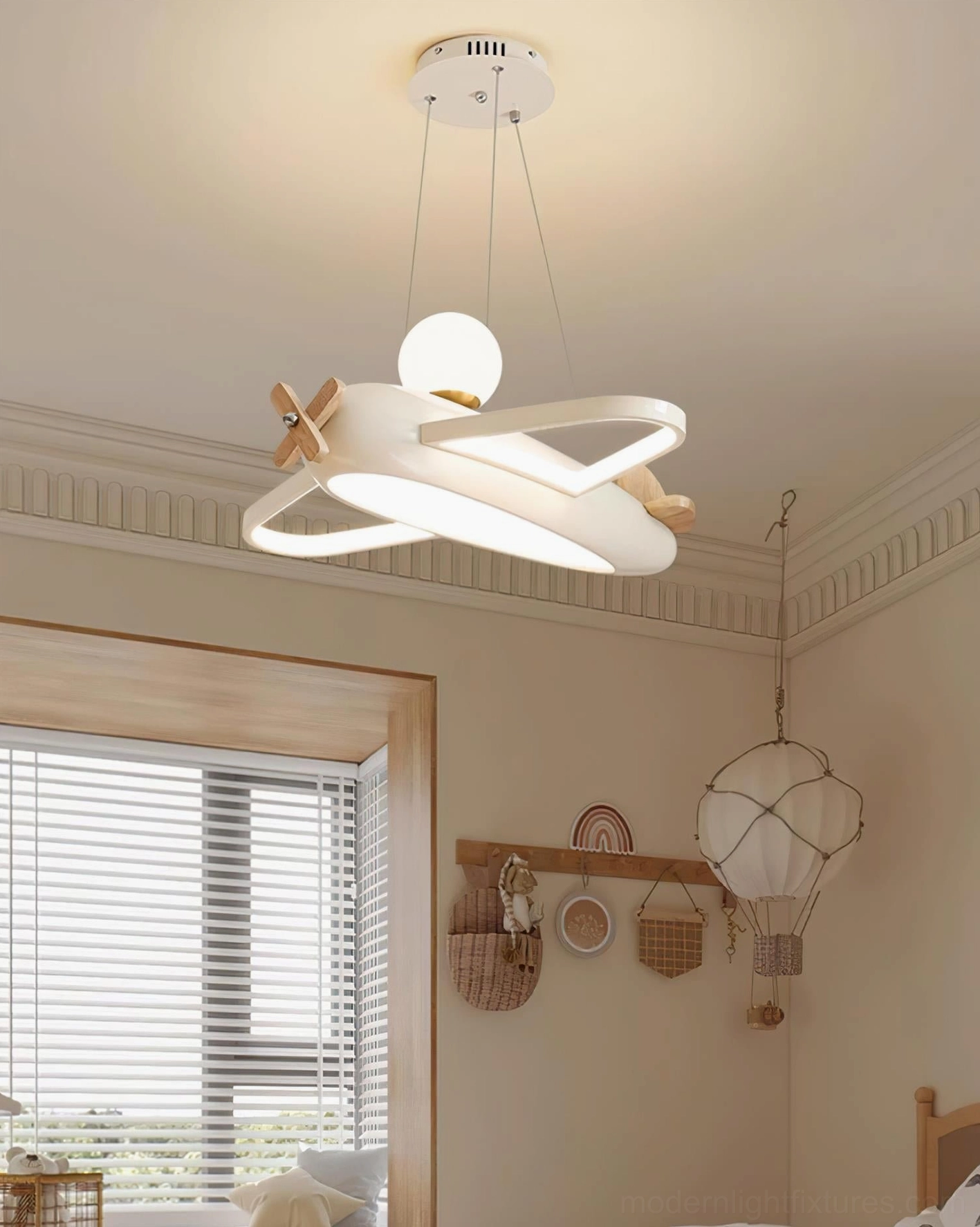 Airplane ceiling light fixture demonstrating even 53W light distribution across kids playroom creative space