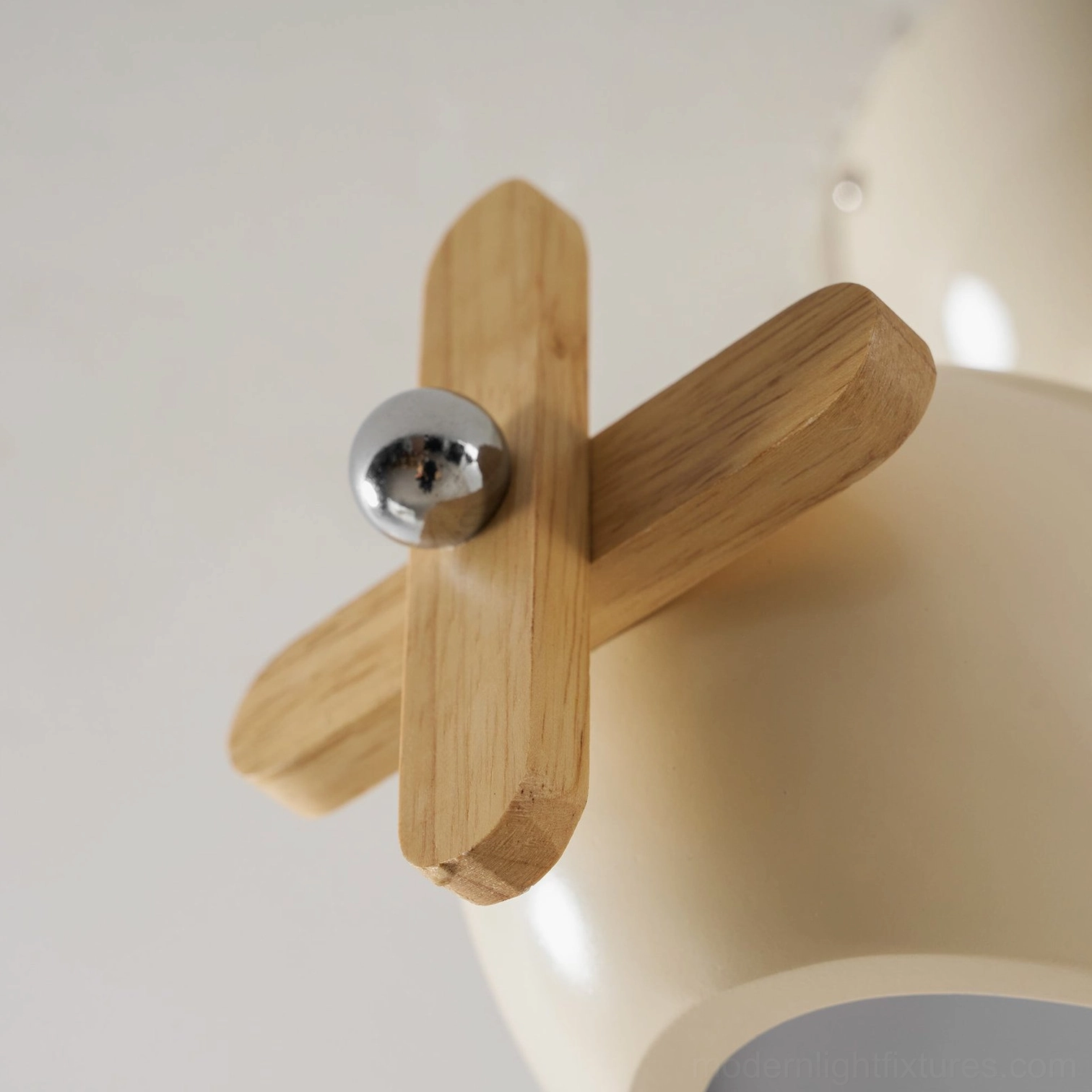Airplane light fixture creating focal point in nursery playroom study nook and creative spaces