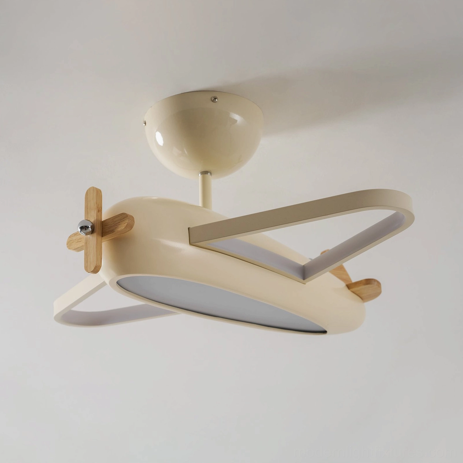 Airplane light fixture metal body with wooden propeller accent combining materials for visual interest