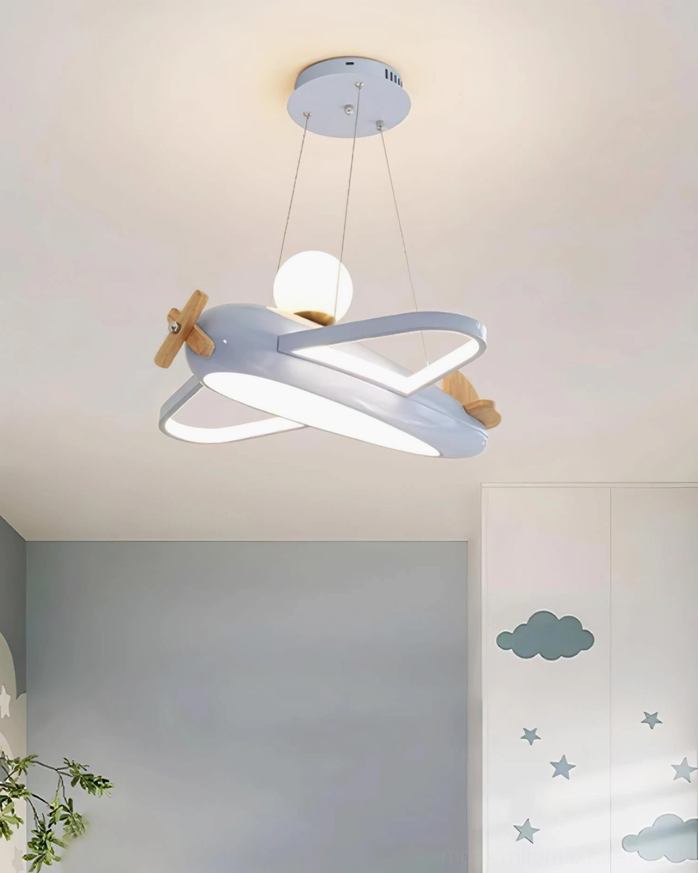 Close up of airplane pendant lamp body showing clean lines metal frame acrylic detail construction