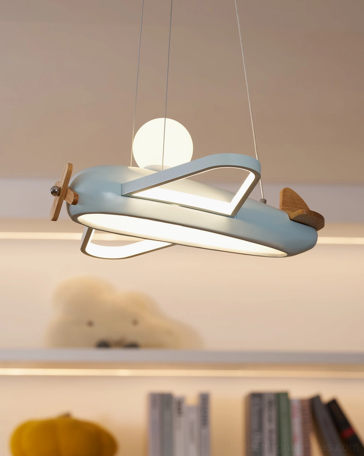 Modern airplane pendant lamp product shot showing overall form proportions and sculptural aircraft design