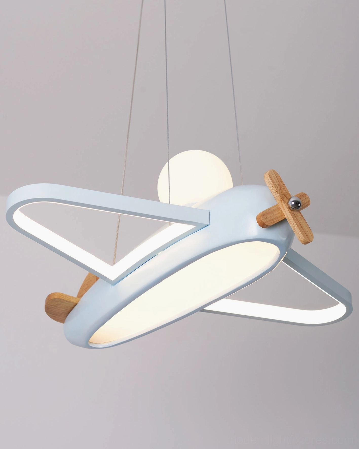 Modern airplane pendant light architectural view showing installation angle and relationship to room proportions