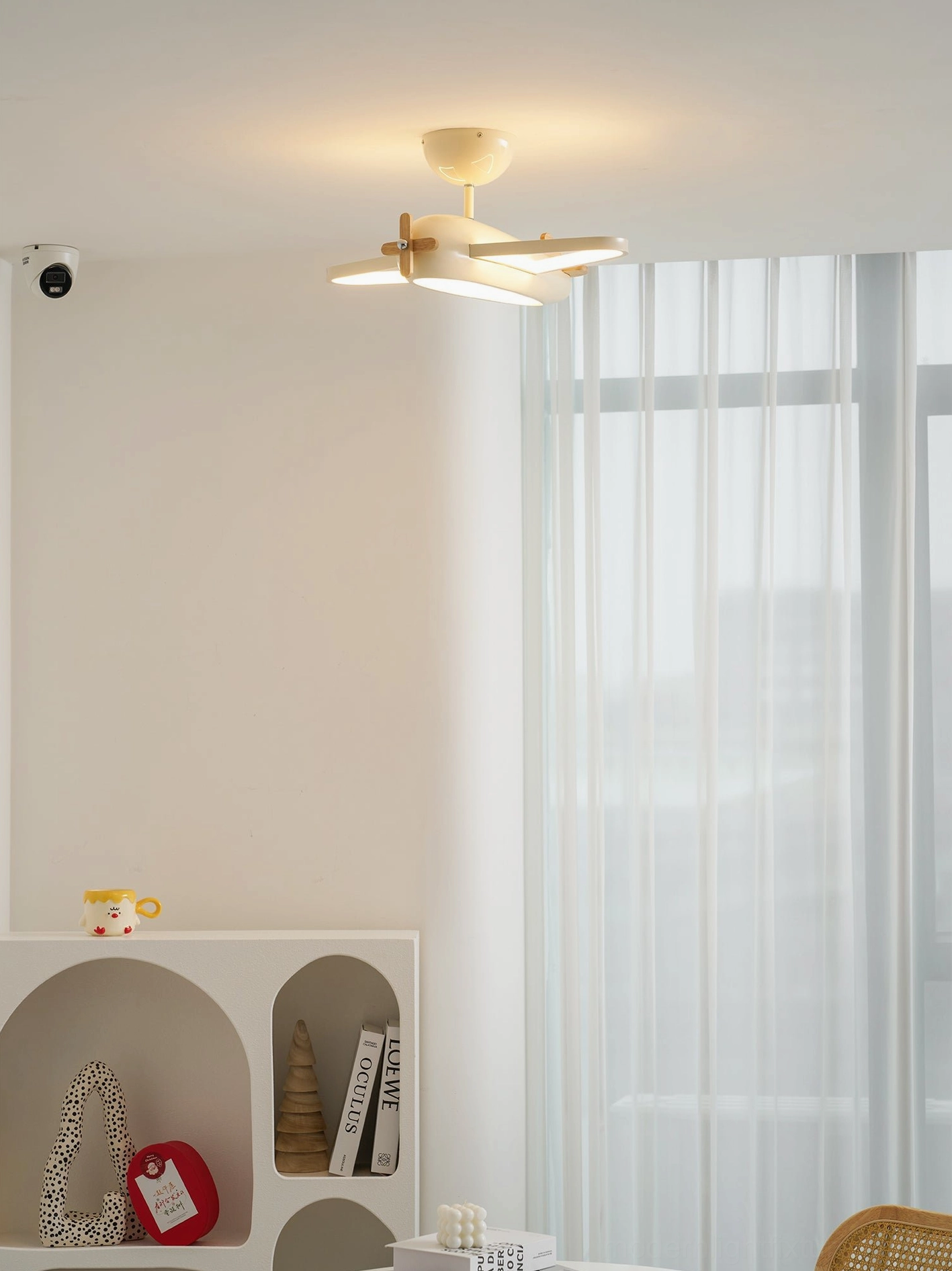 Airplane ceiling light fixture from side angle showing aerodynamic silhouette and design profile