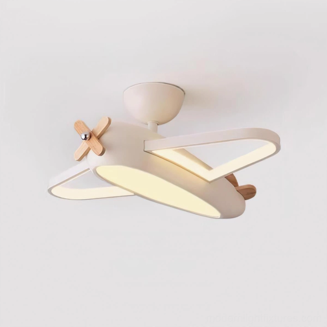 Airplane pendant light with wooden propeller detail creating warm ambient glow in child's room