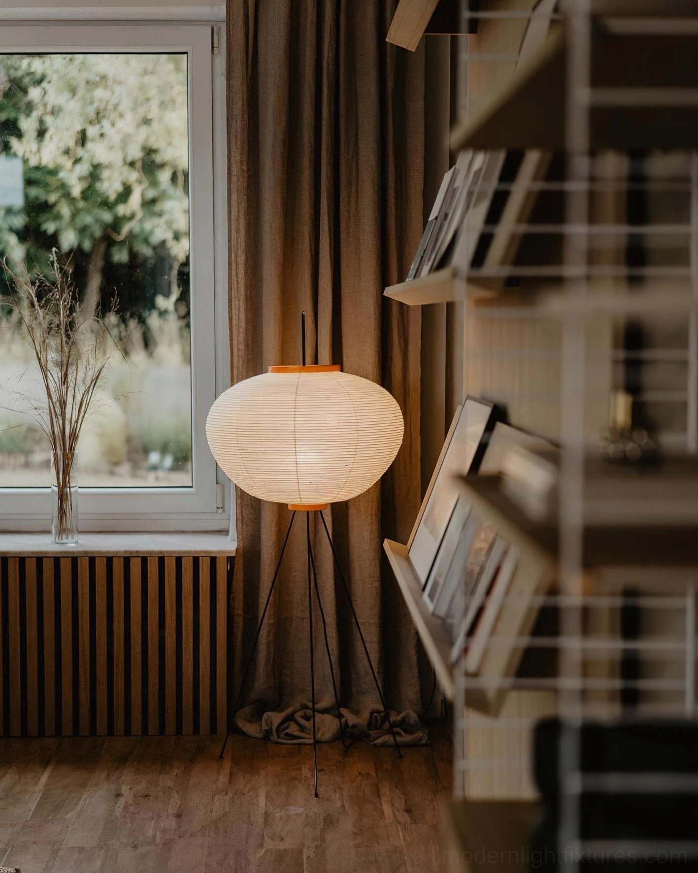 Akari 10A white paper floor lamp illuminated in evening mood lighting setup