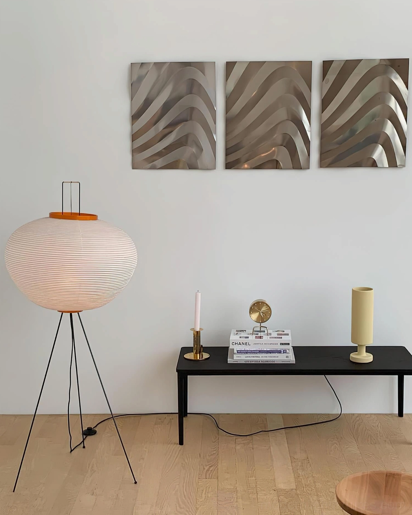 Akari 10A Japanese minimalist floor lamp close-up of pleated paper shade and metal tripod construction