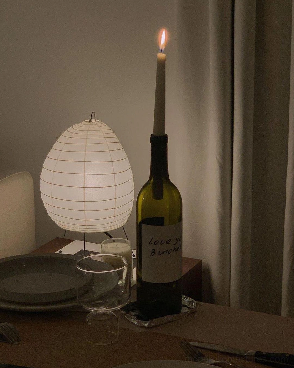 Akari 1N Japanese minimalist washi paper lamp with black steel tripod frame architectural detail and sculptural form