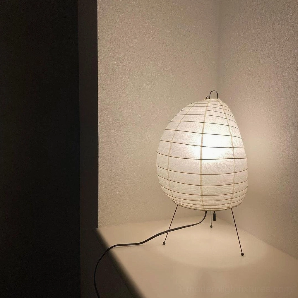 Akari 1N washi paper table lamp showing soft warm light diffusion through Japanese traditional paper material