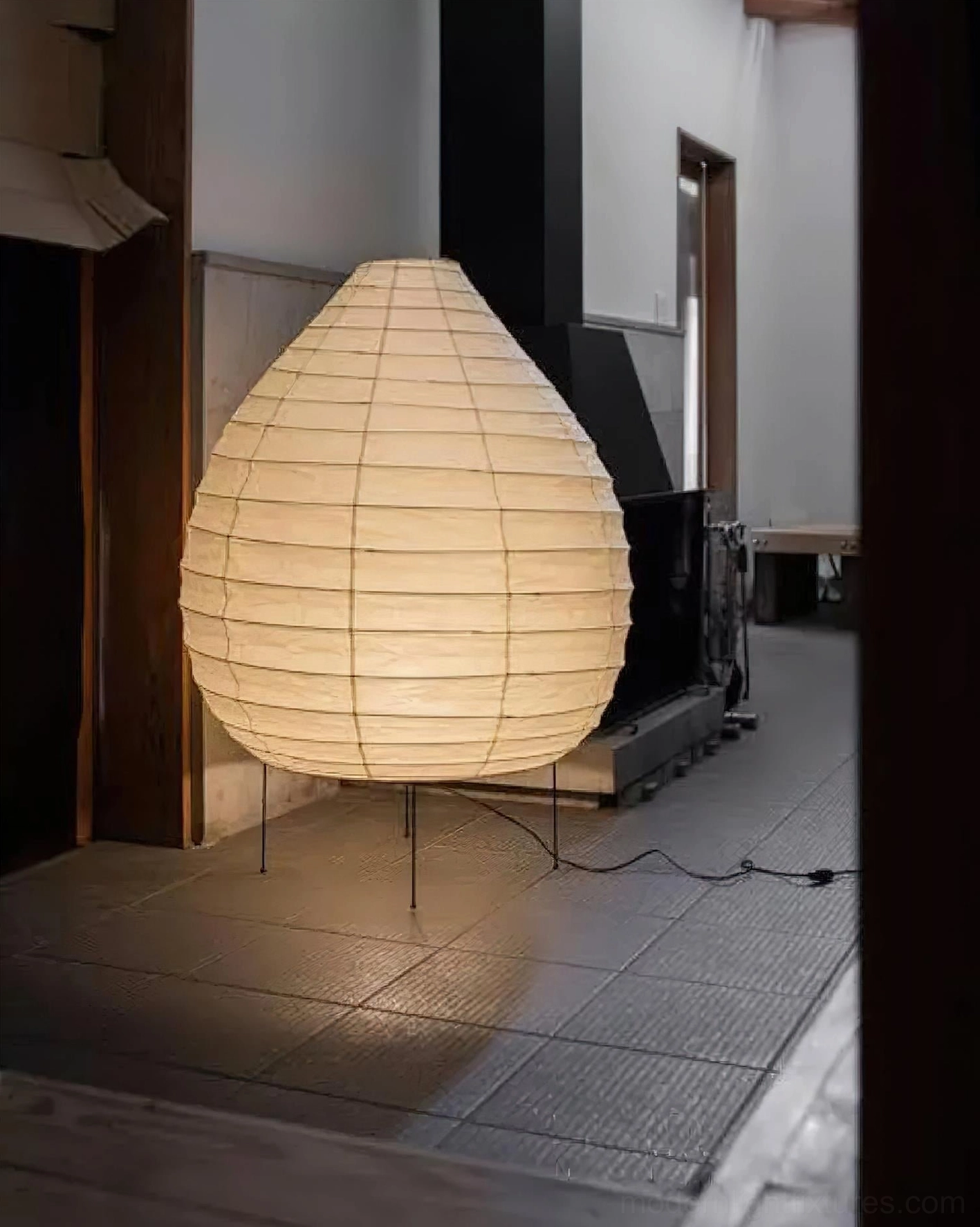 Akari 23N teardrop floor lamp creating soft atmospheric lighting in contemporary home