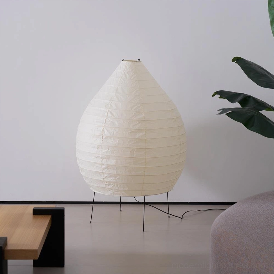 Akari 23N floor lamp creating warm diffused light in scandinavian style living room