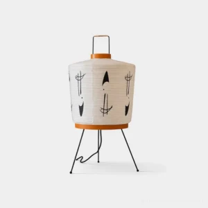 Akari 2A modern paper table lamp with white ribbed shade, black abstract hand-drawn graphics, and orange trim detail on sleek tripod stand